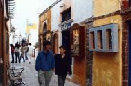 Therese and Paul walk the cobblestone streets of Oia